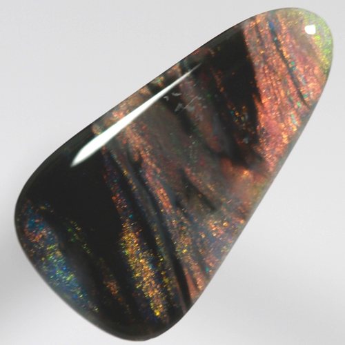 SOLID BLACK OPAL Banded pattern of red and green amongst black bands